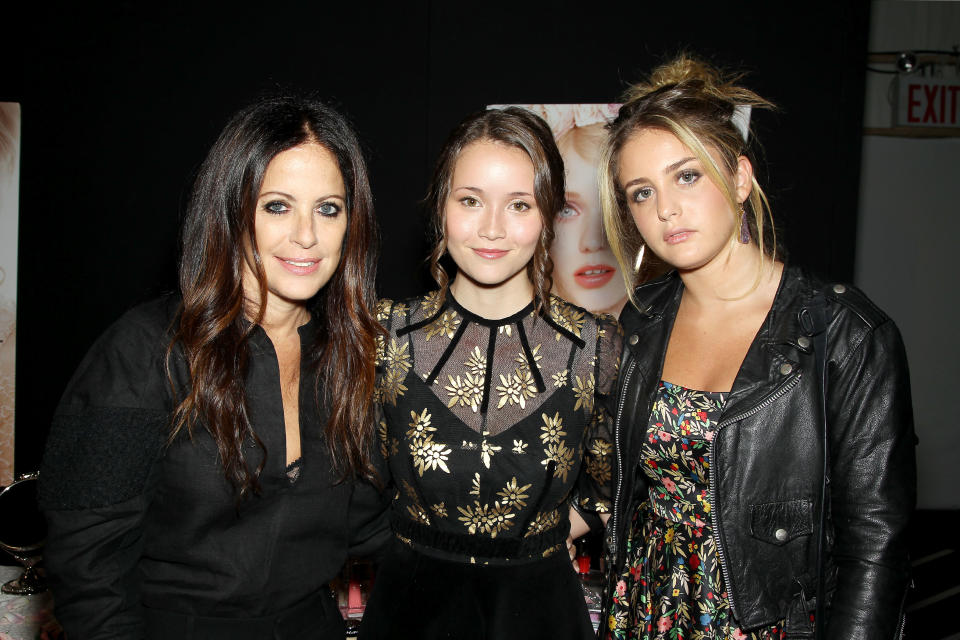 This image released by Starpix shows designer Jill Stuart, left, Katie Chang and Sophie Curtis at the Jill Stuart Spring 2014 show during Fashion Week in New York, Saturday, Sept. 7, 2013. (AP Photo/Starpix, Marion Curtis)