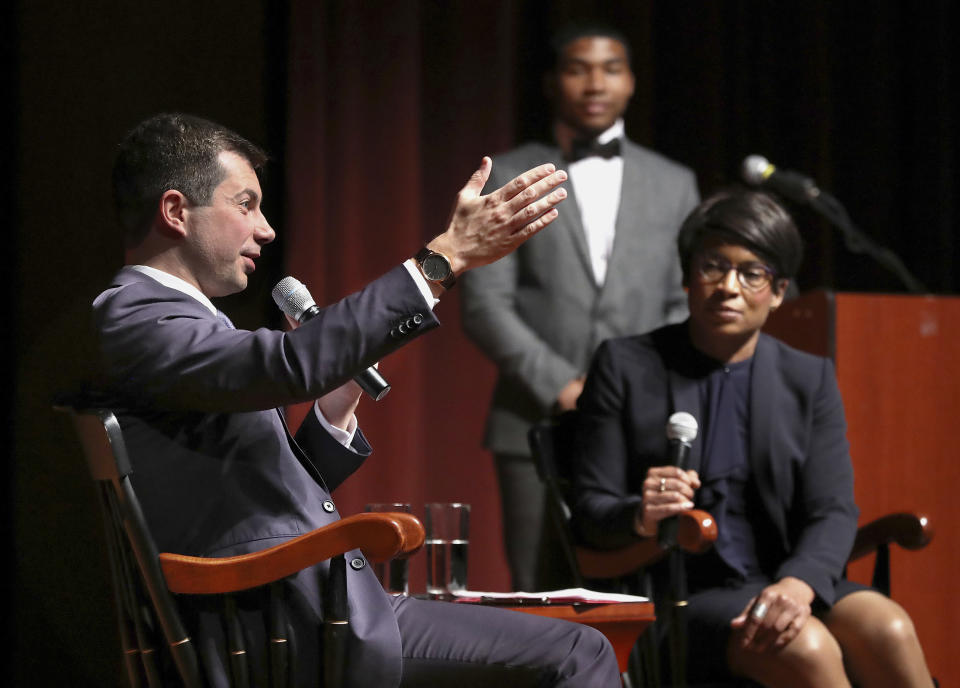 Presidential hopeful Pete Buttigieg, Mayor of South Bend, Ind., holds a conversation with Dr. Adrienne Jones, right, at Morehouse College on Monday, Nov. 18, 2019, in Atlanta. (Curtis Compton/Atlanta Journal-Constitution via AP)