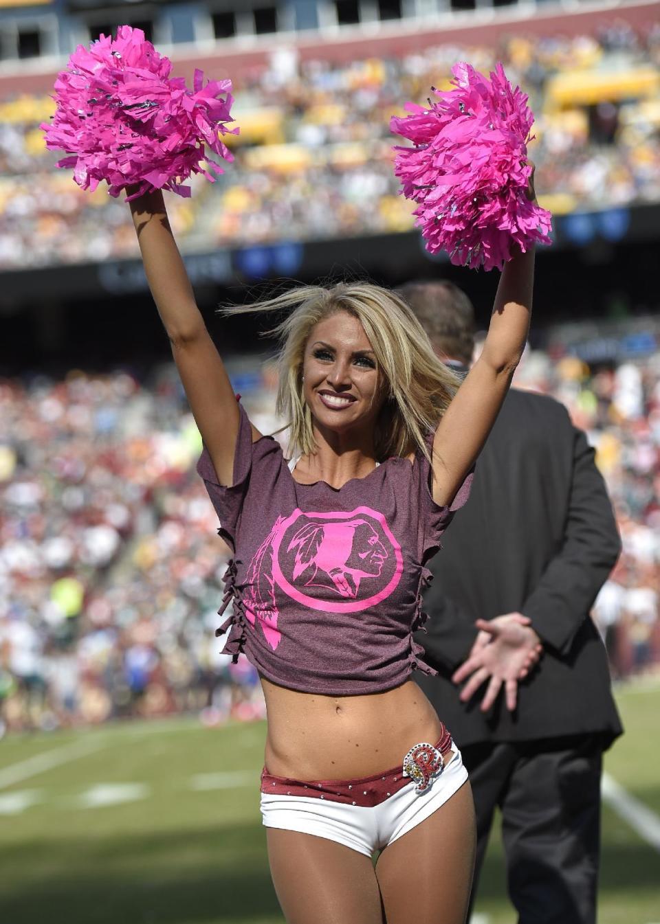 <p>A Washington Redskins cheerleader performs during an NFL football game between the Redskins and the Philadelphia Eagles, Sunday, Oct. 16, 2016, in Landover, Md. (AP Photo/Nick Wass) </p>