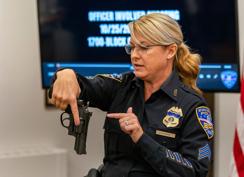 Evansville Police Department spokeswoman Sgt. Anna Gray points to a similar airsoft gun like the one used in the officer involved shooting that occurred in the 1700 block of South Evans Avenue Wednesday during a news conference at EPD headquarters Thursday, Oct. 26, 2023.