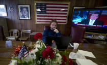 Andrew Firestone, 29, a field organizer for Columbiana County, Ohio, checks news at Republican headquarters November 6, 2012 in Lisbon, Ohio. (Photo by Jeff Swensen/Getty Images)