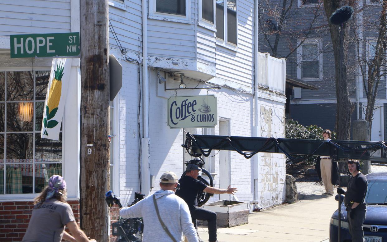 Crew from Twentieth Century Studios prepares to film a scene at Pratt Street and Olney Street, which has been dubbed "Hope St. NW" for the movie "Ella McCay."