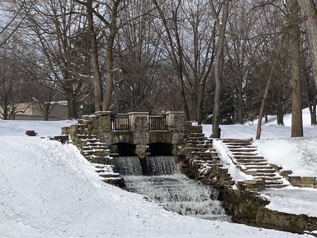 Picturesque winter scenes at Canton's Monument Park following a brief winter storm Friday evening, March 11, 2022.
