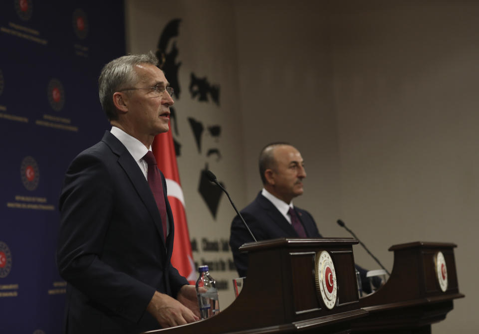 NATO Secretary-General Jens Stoltenberg, left, and Turkey's Foreign Minister Mevlut Cavusoglu speak to the media after their talks in Ankara, Turkey, Monday, Oct. 5, 2020. Stoltenberg said the 30-country military alliance is "deeply concerned by the escalation of hostilities " between Azerbaijan and Armenia and he urged Turkey to help end the fighting. (AP Photo/Burhan Ozbilici)