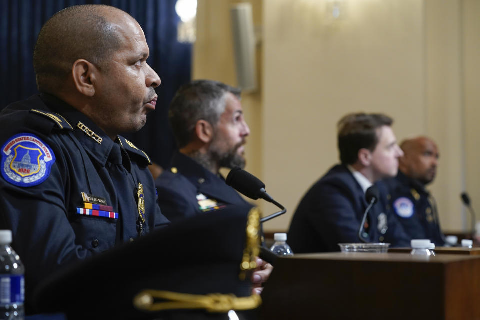 From left, U.S. Capitol Police Sgt. Aquilino Gonell, Washington Metropolitan Police Department officer Michael Fanone, Washington Metropolitan Police Department officer Daniel Hodges and U.S. Capitol Police Sgt. Harry Dunn watch a video of the rioters during the House select committee hearing on the Jan. 6 attack on Capitol Hill in Washington, Tuesday, July 27, 2021. (AP Photo/ Andrew Harnik, Pool)