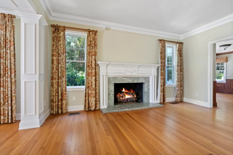 Touches include this woodburning fireplace. Coastal Home Photography