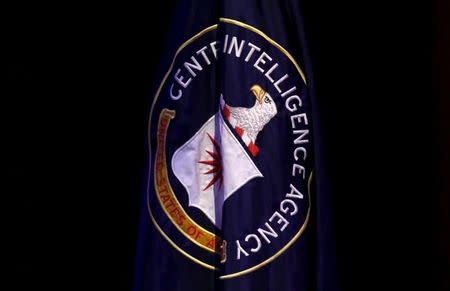 The Central Intelligence Agency (CIA) flag is displayed on stage during a conference on national security entitled "The Ethos and Profession of Intelligence" in Washington October 27, 2015. REUTERS/Yuri Gripas