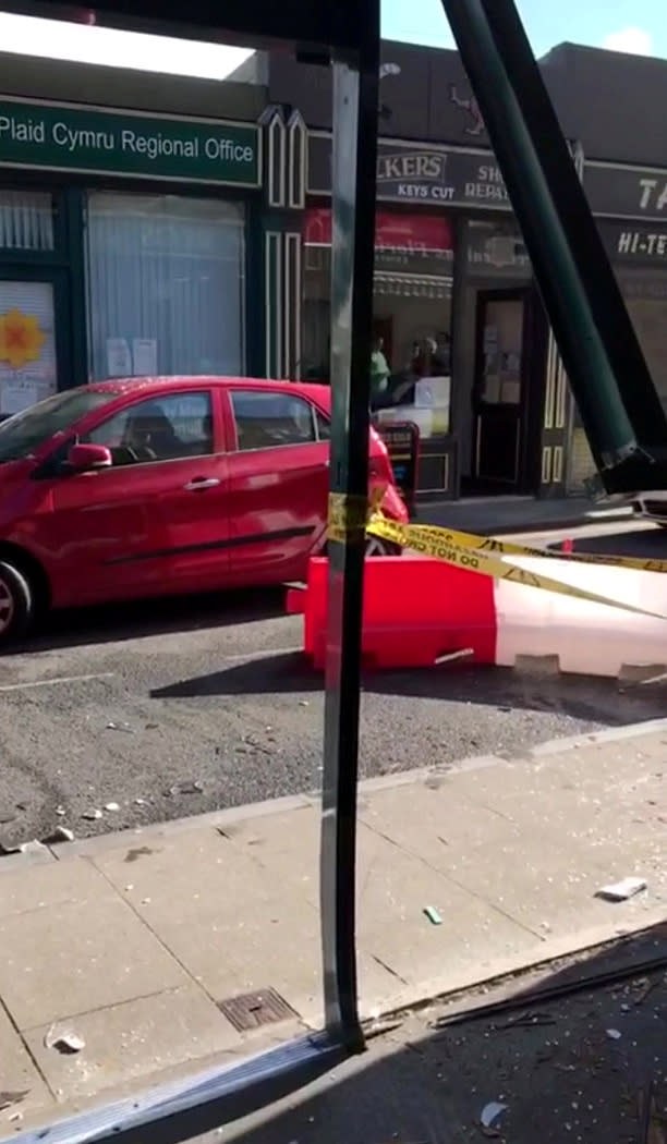 Customers escaped death by inches after a runaway car ploughed through the front of a busy cafe while they were eating breakfast