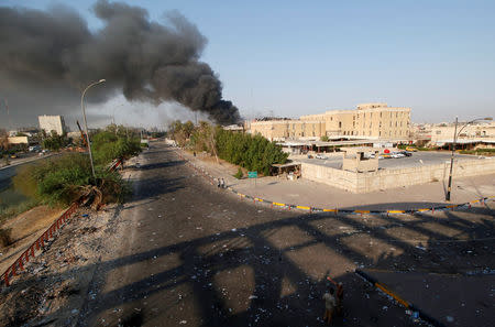 Smoke rises from the governorate and municipalities buildings of Basra, Iraq September 6, 2018. REUTERS/Essam al-Sudani