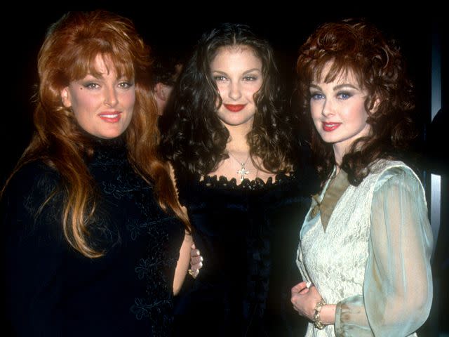 <p>Ron Davis/Getty</p> Wynonna Judd, Ashley Judd and Naomi Judd pose for a portrait during Ashley's movie premiere circa 1996 in Los Angeles, California.