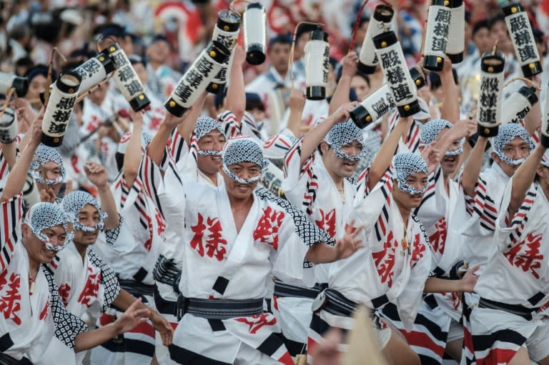 Participants of a "load team" perform during the Awa Odori festival in Tokushima on August 12, 2017 - the four-day dance festival attracts more than 1.2 million people annually