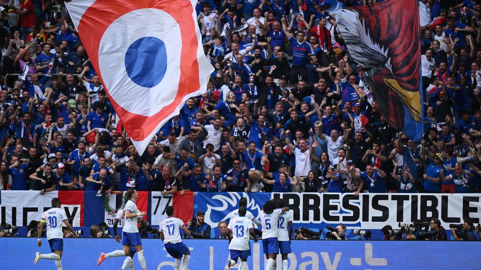 France players celebrate with their fans after scoring the only goal of the game to beat Belgium and advance to the quarterfinals of Euro 2024. - Clive Mason/Getty Images