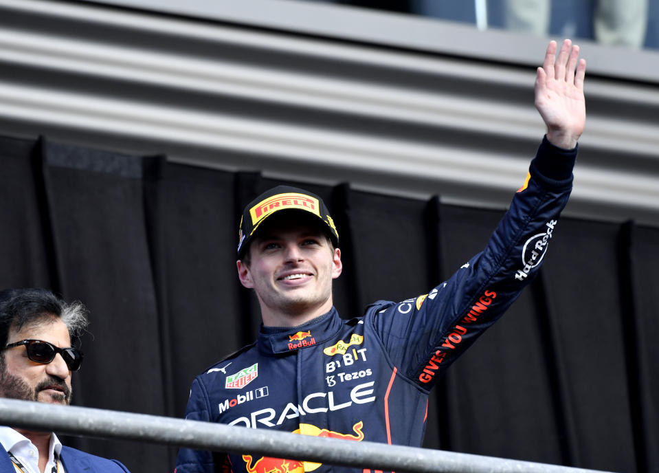 First place Red Bull driver Max Verstappen of the Netherlands waves to the crowd as he steps on to the podium during the Formula One Grand Prix at the Spa-Francorchamps racetrack in Spa, Belgium, Sunday, Aug. 28, 2022. (AP Photo/Geert Vanden Wijngaert)