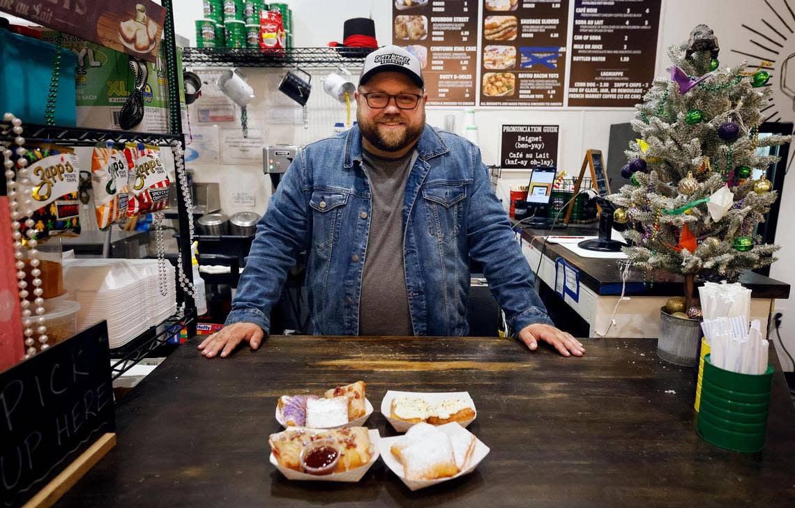 Trey Smith, owner of Dusty Biscuit Beignet, shows some of the variations of beignets available at his establishment on Friday, November 17, 2023. Dusty Biscuit Beignet is the winner of the Star-Telegram’s Readers Choice for favorite donut shop.