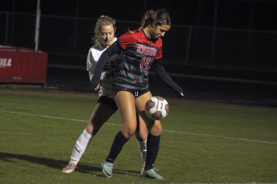 Creekside fullback Lily Paisant (14) controls the ball against Nease.