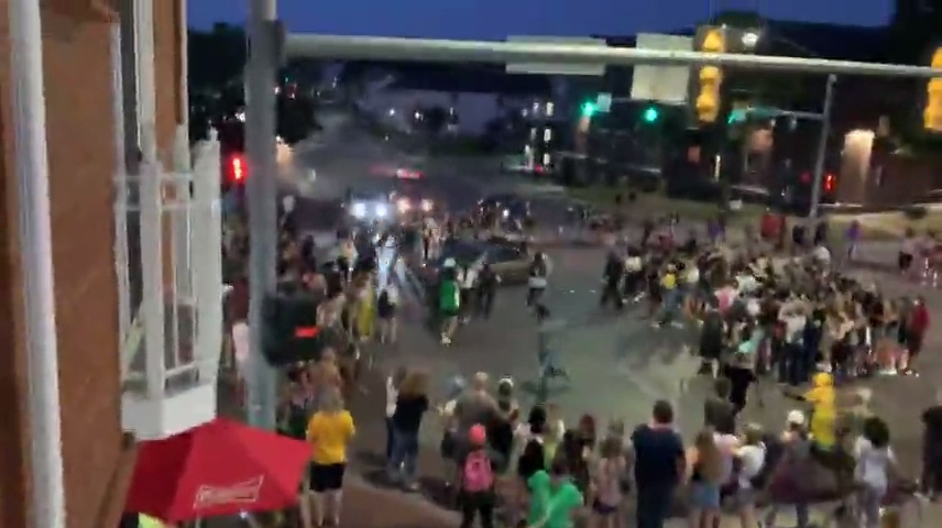 This video still shows a car driving through a protest organized by the Iowa Freedom Riders Aug. 21, 2020, in Iowa City.