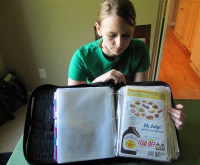 Monica Knight, a dental hygienist and mother of two, shows her coupon binder at her home in Boise, Idaho. Knight, a used to spend spent $600 a month on groceries. Thanks to extreme couponing she's down to $100-150 a month. (AP Photo/Jessie L. Bonner)