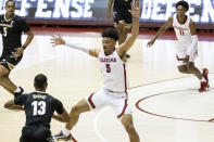 Alabama guard Jaden Shackelford (5) defends against Vanderbilt guard Issac McBride (13) during the first half of an NCAA basketball game on Saturday, Feb. 20, 2021, in Tuscaloosa, Ala. (AP Photo/Vasha Hunt)