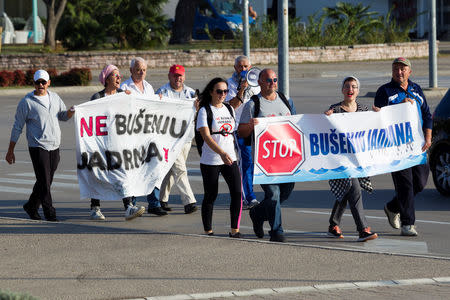 Environmental activists shout slogans during a march from the coastal town of Ulcinj in the south to Herceg Novi in the north, in Bar, Montenegro, November 9, 2018. Picture taken November 9, 2018. REUTERS/Stevo Vasiljevic