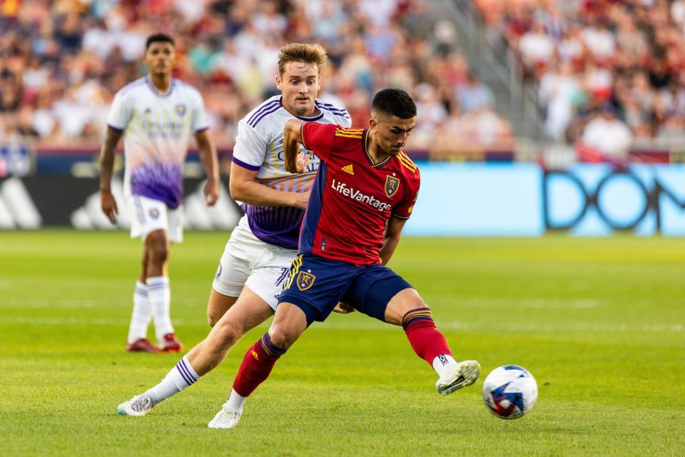 Orlando City <span class="caas-xray-inline-tooltip"><span class="caas-xray-inline caas-xray-entity caas-xray-pill rapid-nonanchor-lt" data-entity-id="Duncan_McGuire_(soccer)" data-ylk="cid:Duncan_McGuire_(soccer);pos:3;elmt:wiki;sec:pill-inline-entity;elm:pill-inline-text;itc:1;cat:Athlete;" tabindex="0" aria-haspopup="dialog"><a href="https://search.yahoo.com/search?p=Duncan%20McGuire" data-i13n="cid:Duncan_McGuire_(soccer);pos:3;elmt:wiki;sec:pill-inline-entity;elm:pill-inline-text;itc:1;cat:Athlete;" tabindex="-1" data-ylk="slk:Duncan McGuire;cid:Duncan_McGuire_(soccer);pos:3;elmt:wiki;sec:pill-inline-entity;elm:pill-inline-text;itc:1;cat:Athlete;" class="link ">Duncan McGuire</a></span></span> and Real Salt Lake Pablo Ruiz fight for possession of the ball at the America First Field in Sandy on Saturday, July 8, 2023. | Megan Nielsen, Deseret News