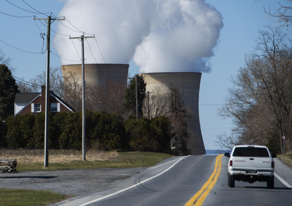 A car drives past the nuclear plant on Three Mile Island, with the operational plant run by Exelon Generation on the right, in Middletown, Pennsylvania on March 26, 2019. (Photo by ANDREW CABALLERO-REYNOLDS / AFP)        (Photo credit should read ANDREW CABALLERO-REYNOLDS/AFP via Getty Images)