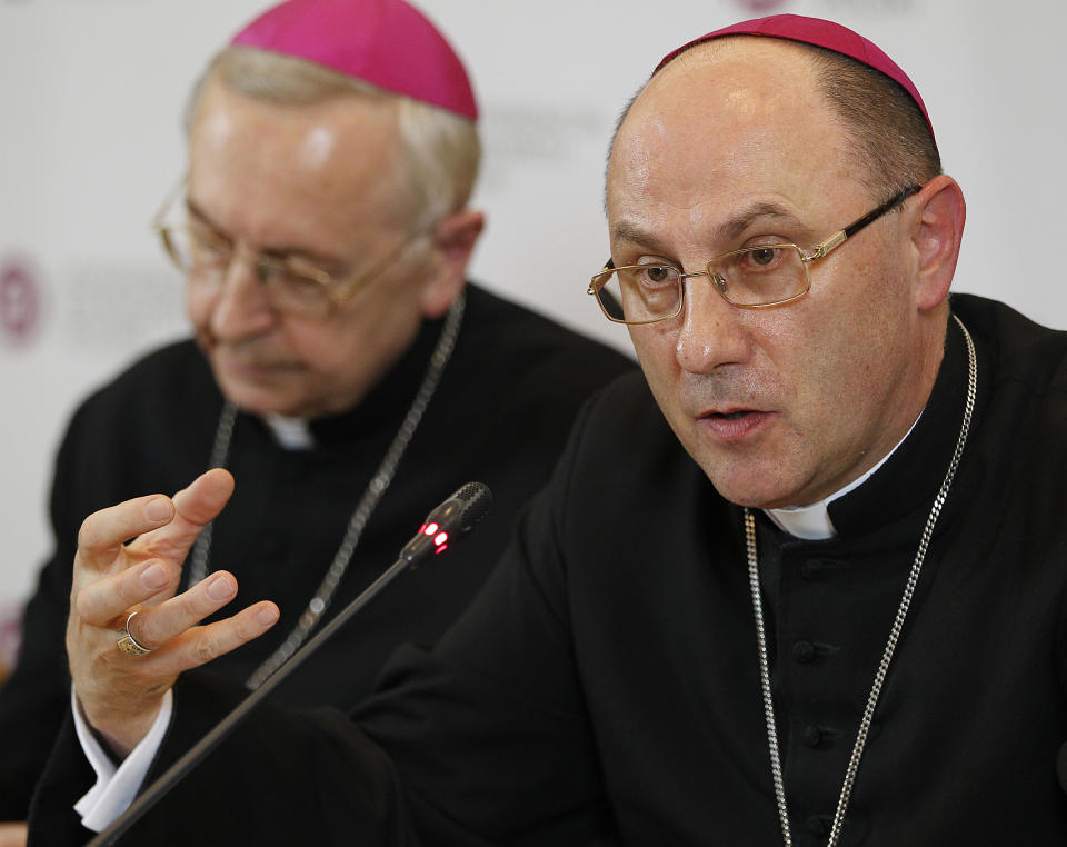 FILE -- In this file photo taken on March 14, 2019, Archbishop Wojciech Polak, right, the Roman Catholic primate of Poland, addresses the media during a news conference at the episcopate building in Warsaw. Pope Francis has named a temporary administrator to lead a southern Polish diocese where the bishop has been accused of covering up cases of sexual abuse that were featured in a second abuse documentary that has rocked Poland's Catholic Church. (AP Photo/Czarek Sokolowski)