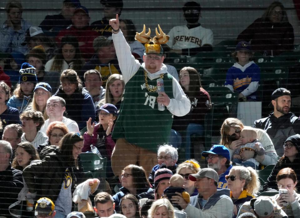 A Milwaukee Bucks fan is seen during the fifth inning of Milwaukee Brewers vs. the St. Louis Cardinals game at American Family Field in Milwaukee on Sunday.