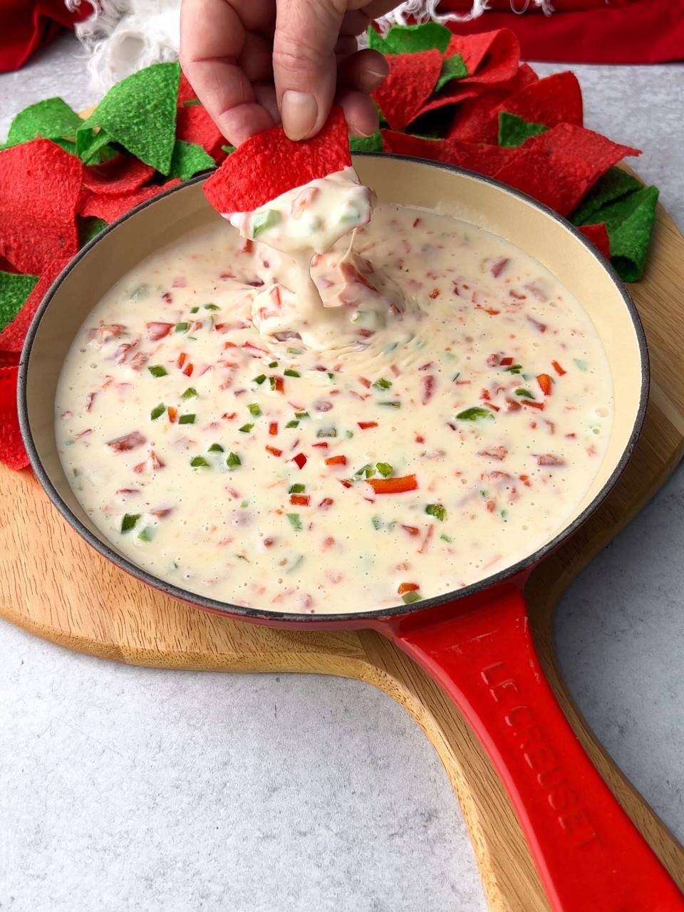 For the added holiday color in Queso Blanco, use finely diced red bell peppers and finely diced jalapeño peppers