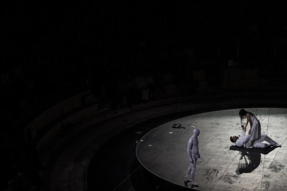 Korean soprano Anna Sohn, right, and Italian tenor Andrea Care, second right, perform at the Odeon of Herodes Atticus for a performance of "Madame Butterfly" in Athens, on Thursday, June 1, 2023. The annual arts festival in Athens and at the ancient theater of Epidaurus in southern Greece is dedicated this year to the late opera great Maria Callas who was born 100 years ago. (AP Photo/Petros Giannakouris)