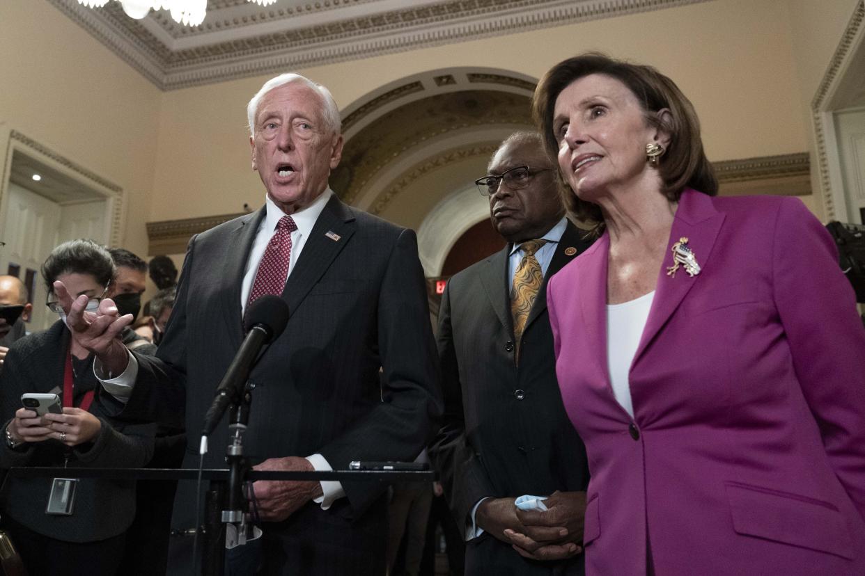 House Majority Leader Steny Hoyer D-Md., accompanied by Speaker of the House Nancy Pelosi, D-Calif., and House Majority Whip James Clyburn, D-S.C., speaks to reporters at the Capitol in Washington, Friday, Nov. 5, 2021, as the House is considering President Joe Biden's domestic policy package. (AP Photo/Jose Luis Magana)