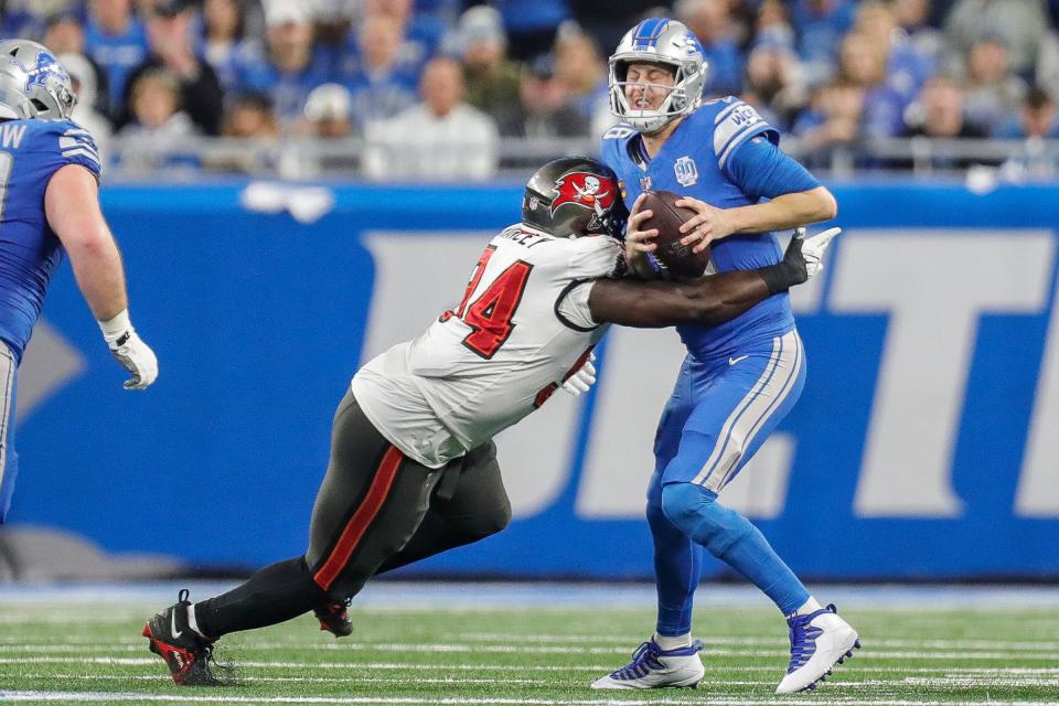 Detroit Lions quarterback Jared Goff (16) is sacked by Tampa Bay Buccaneers defensive tackle Calijah Kancey (94) during the first half of the NFC divisional round at Ford Field in Detroit on Sunday, Jan. 21, 2024.