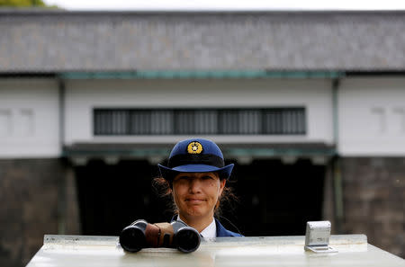 An Imperial Guard officer stands guard in front of the Sakashita-mon gate of the Imperial Palace in Tokyo, Japan, April 29, 2019. REUTERS/Kim Kyung-hoon