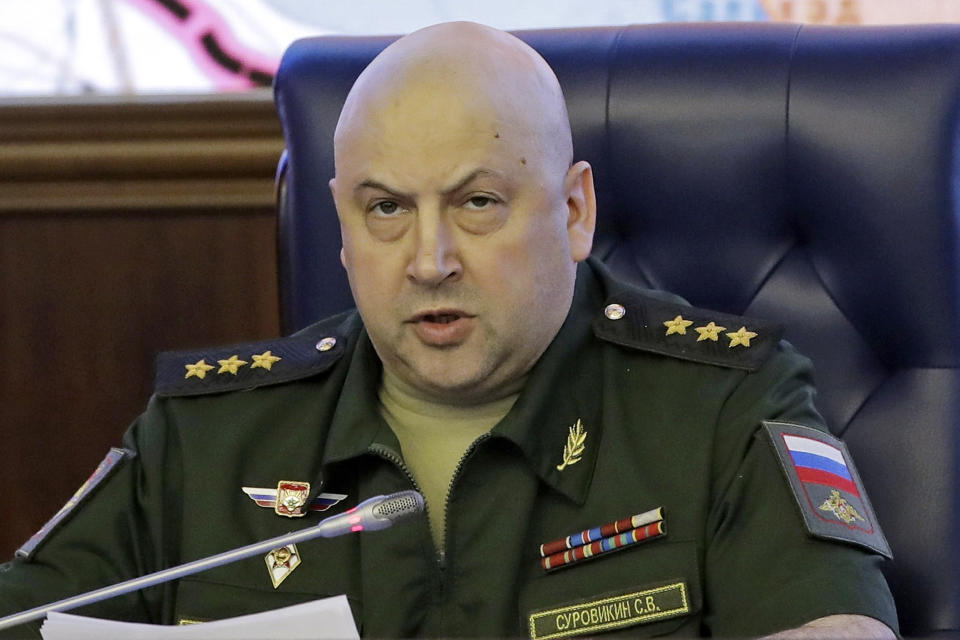 FILE - Colonel General Sergei Surovikin, Commander of the Russian forces in Syria, speaks, with a map of Syria projected on the screen in the back, at a briefing in the Russian Defense Ministry in Moscow, Russia, June 9, 2017. Russia’s president has succeeded in exiling Wagner mercenary head Yevgeny Prigozhin, who led a brief mutiny last week, but the fate of several top generals is still unclear. There were unconfirmed reports that one of them with ties to Prigozhin has been arrested and another was mysteriously absent from several events attended by President Vladimir Putin and embattled Defense Minister Sergei Shoigu. (AP Photo/Pavel Golovkin, File)