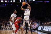 Kansas State's Markquis Nowell (1) shoots in the first half of an Elite 8 college basketball game against Florida Atlantic in the NCAA Tournament's East Region final, Saturday, March 25, 2023, in New York. (AP Photo/Adam Hunger)