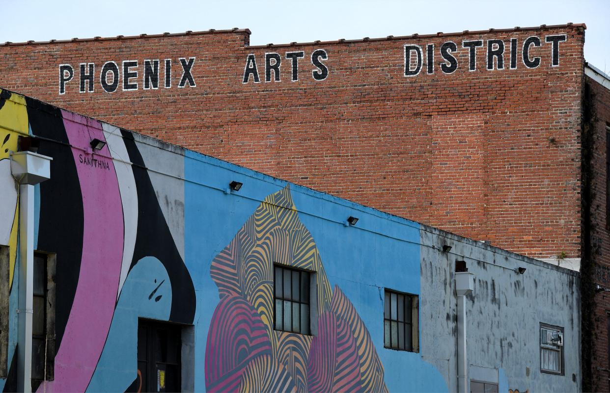 Street art covers the facades of two buildings that make up the Phoenix Arts District in Jacksonville's Springfield neighborhood. The district is in the early phase of being redeveloped and incorporated with the Emerald Trail project.