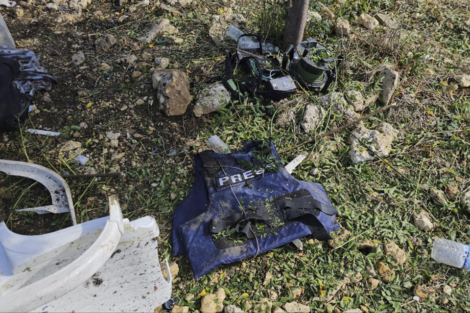 A protective vest of one of the two journalists of pan-Arab TV network Al-Mayadeen who was killed by an Israeli strike lies on the ground at the Lebanese border village of Tair Harfa near the border with Israel, Tuesday, Nov. 21, 2023. An Israeli strike on southern Lebanon killed Tuesday two journalists reporting for the Beirut-based Al-Mayadeen TV on the violence along the border with Israel, according to the Lebanese information minister and their TV station. (AP Photo/Mohammed Zinaty)