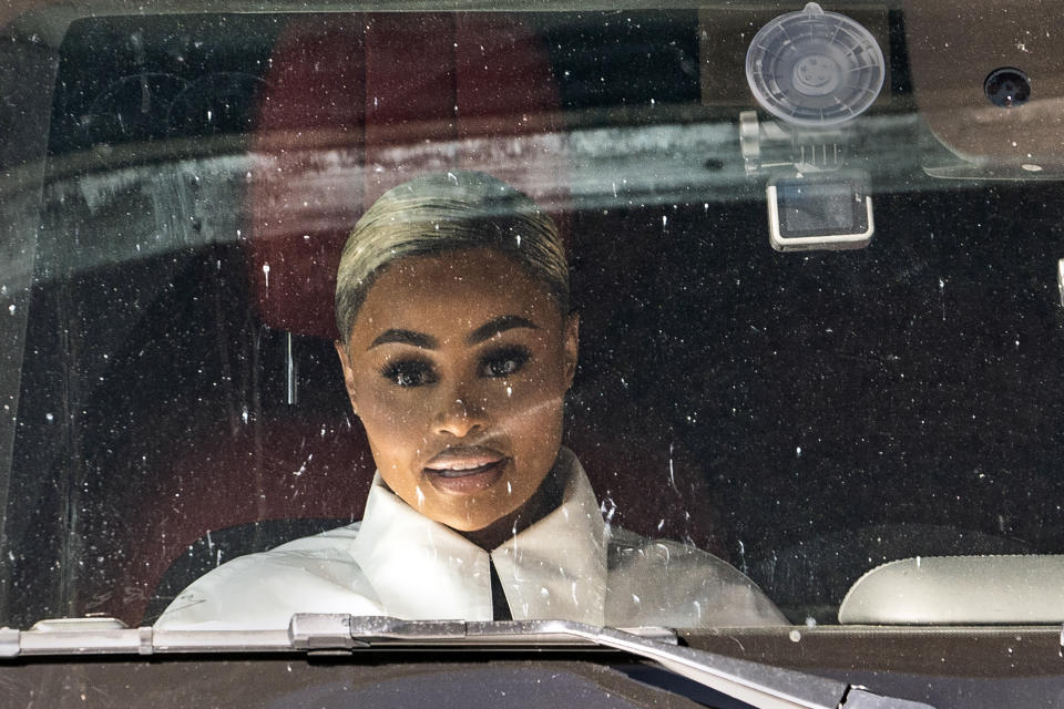 Blac Chyna sits in the passenger seat as she leaves Los Angeles Superior Court in Los Angeles, Friday, April 29, 2022. A judge on Friday threw out part of the case against Kim Kardashian in former reality TV star Blac Chyna's lawsuit while the jury deliberates on the elements that remain. (AP Photo/Damian Dovarganes)