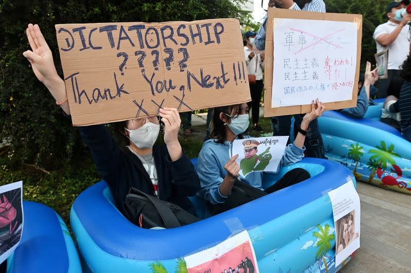 FILE PHOTO: People protest against the military coup and to demand the release of elected leader Aung San Suu Kyi, outside the Japanese Embassy in Yangon