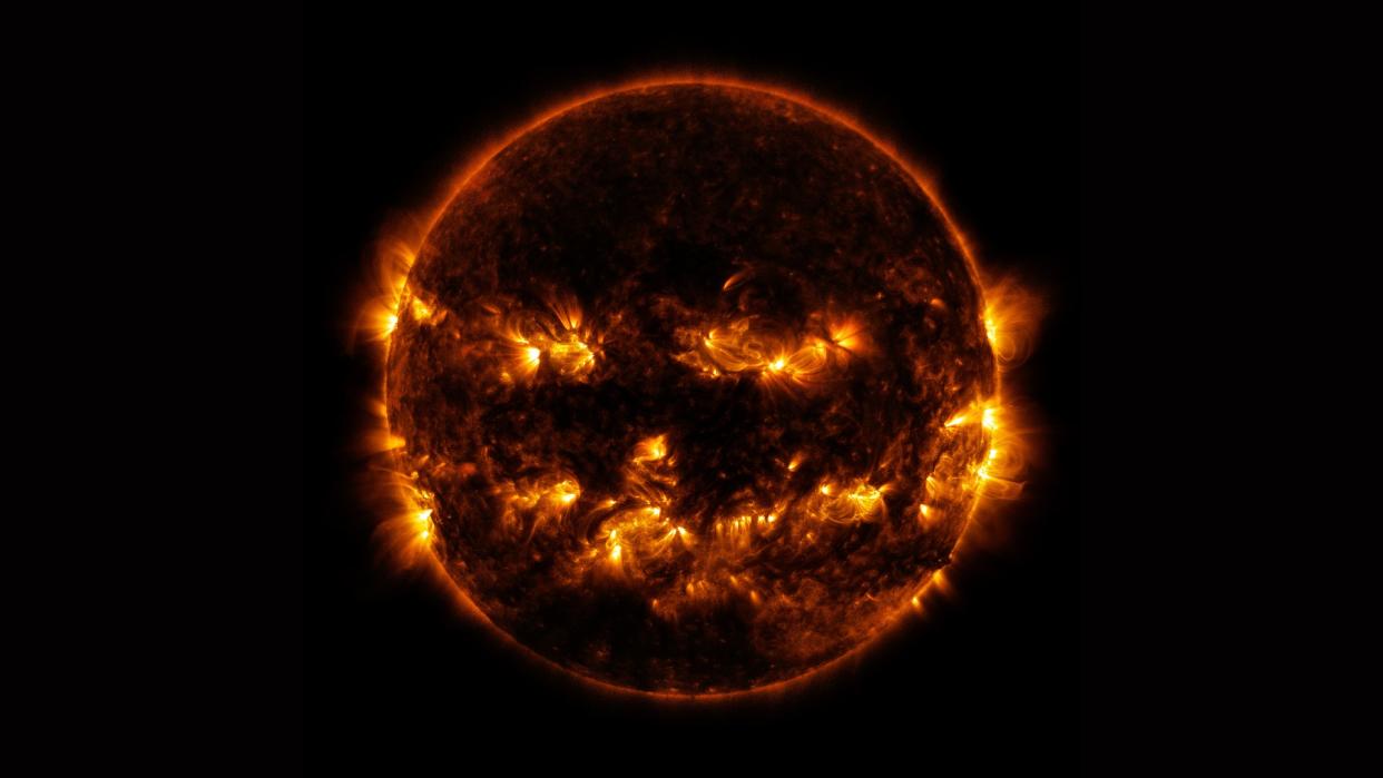  Active regions on the Sun combined to look something like a jack-o-lantern’s face on Oct. 8, 2014. The active regions appear brighter because those are areas that emit more light and energy — markers of an intense and complex set of magnetic fields hovering in the Sun’s atmosphere, the corona. 