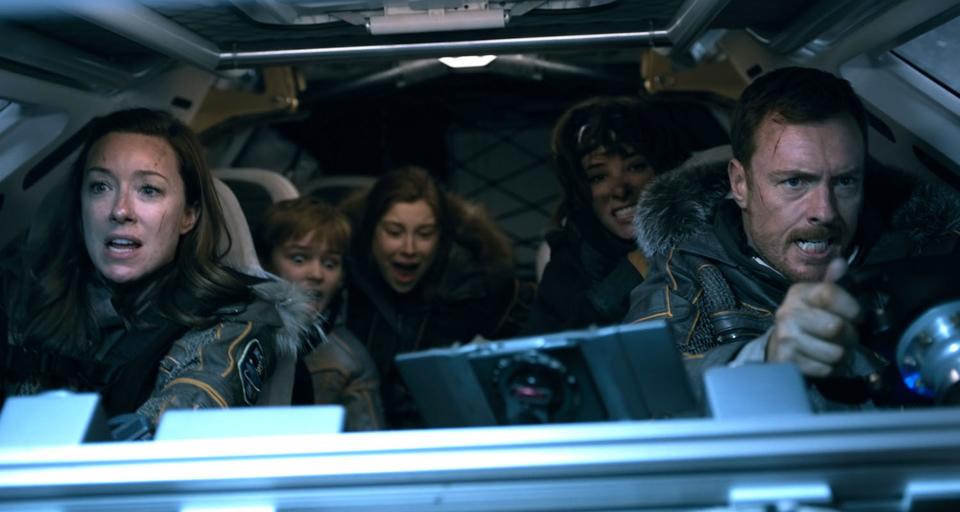 The cast of Netflix's "Lost in Space" as seen in Episode 2 of the new series premiering on April 13, 2018. They are (from left to right: Molly Parker as Maureen Robinson; Max Jenkins as Will; Mina Sundwall as Penny; Parker Posey as Dr. Smith; and Toby Stephens as John. <cite>Netflix</cite>