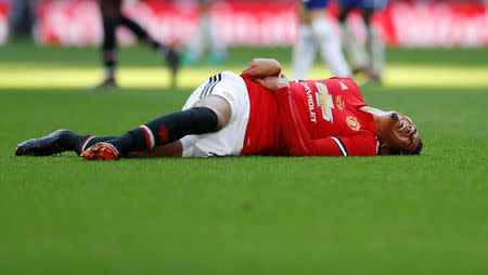 Soccer Football - FA Cup Final - Chelsea vs Manchester United - Wembley Stadium, London, Britain - May 19, 2018 Manchester United's Chris Smalling lies injured Action Images via Reuters/Andrew Couldridge