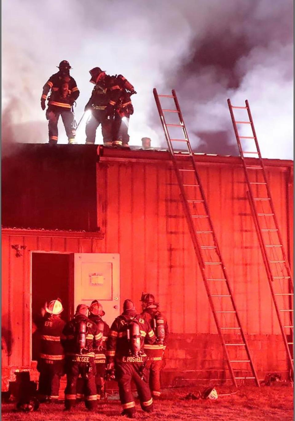 Fire crews work to put out a fire on the night of Dec. 26 at The Twisted Apple in Edneyville.