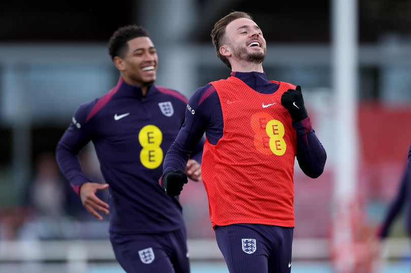 Jude Bellingham and James Maddison of England in action during a training session at St Georges Park on March 22, 2024 in Burton-upon-Trent, England.