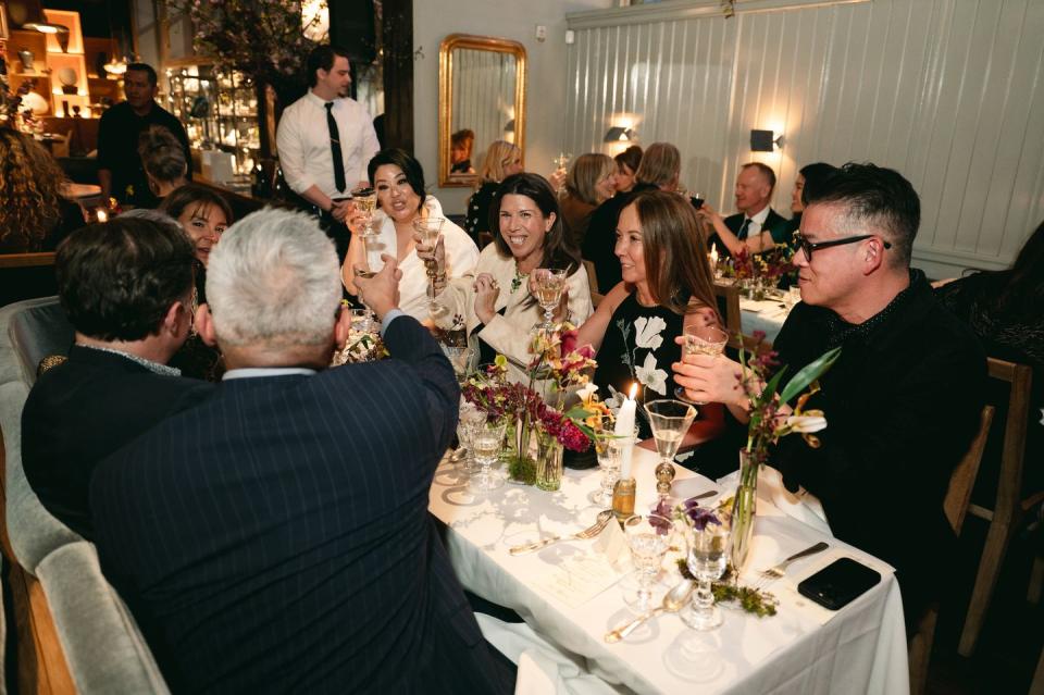 a group of people sitting around a table