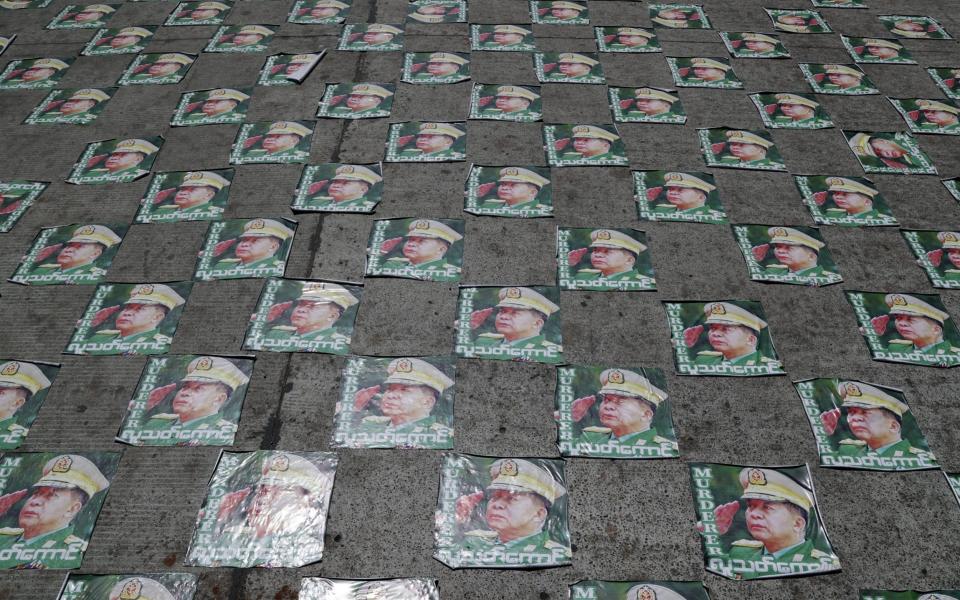 Protesters have laid coup leader General Min Aung Hlaing's image on the streets - Lynn Bo Bo/EPA-EFE/Shutterstock