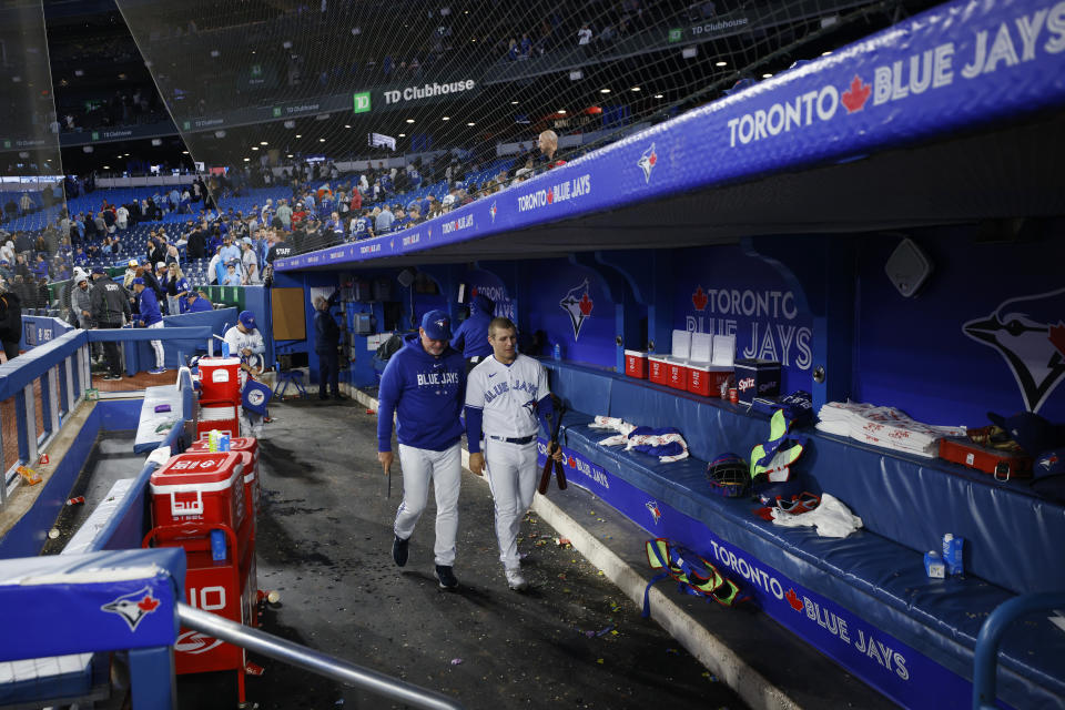 Blue Jays hitting strategist Dave Hudgens (left) could be in jeopardy of losing his job. (Photo by Cole Burston/Getty Images)