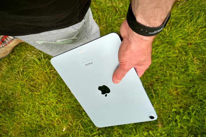 A person holding the Apple iPad Air (2024).