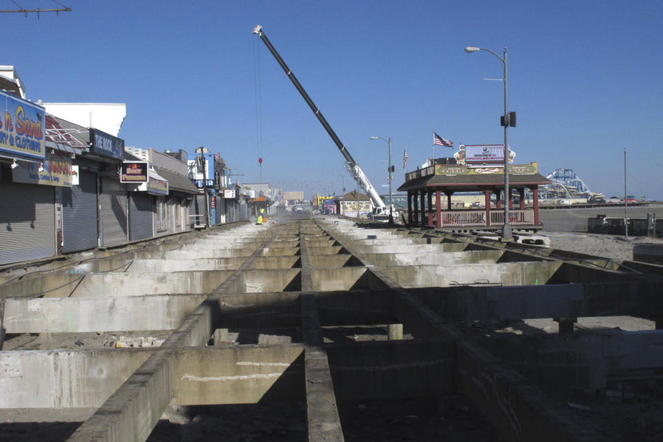 A project to replace part of the boardwalk in Wildwood N.J. was under way in this this Nov. 19, 2021 photo. On Feb. 23, 2024, New Jersey selected 18 Jersey Shore towns to split $100 million in funds to repair or rebuild their boardwalks. (AP Photo/Wayne Parry)