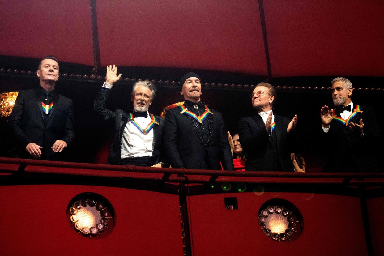 (L-R) Honorees U2 bandmembers Irish musicians Larry Mullen Jr, Adam Clayton, The Edge, Bono and actor George Clooney attend the 45th Kennedy Center Honors at the John F. Kennedy Center for the Performing Arts in Washington, DC, on Dec. 4, 2022.