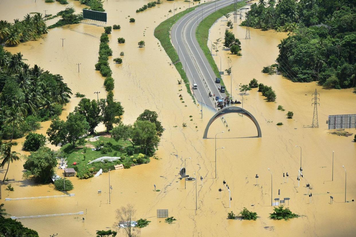 Submerged: A part of a flooded highway exit in a village in Matara, Sri Lanka: REUTERS